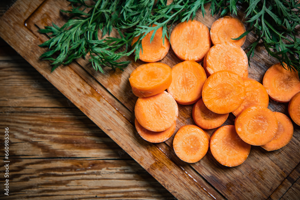 Fresh chopped carrots on cutting board. Fresh chopped carrots on cutting board.