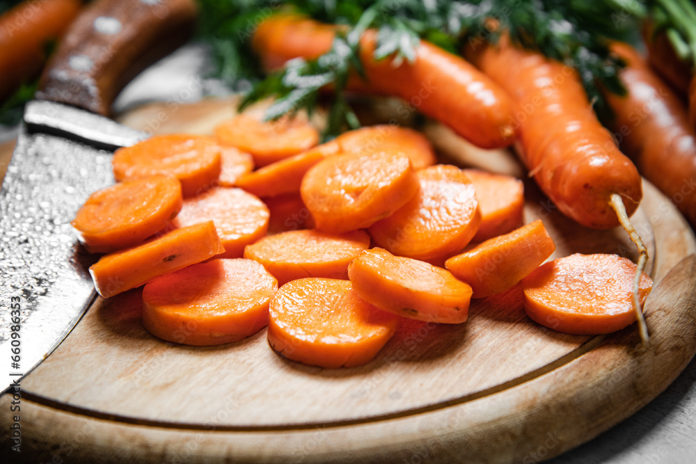 Fresh chopped carrots on cutting board. Fresh chopped carrots on cutting board.