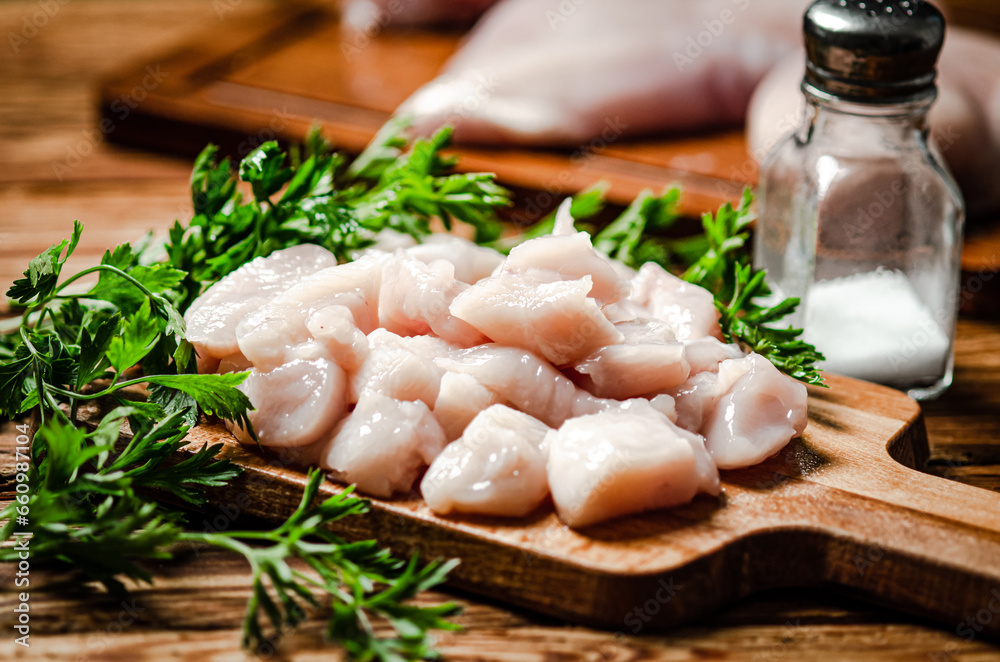 Sliced chicken fillet. On cutting board. Sliced chicken fillet. On cutting board.