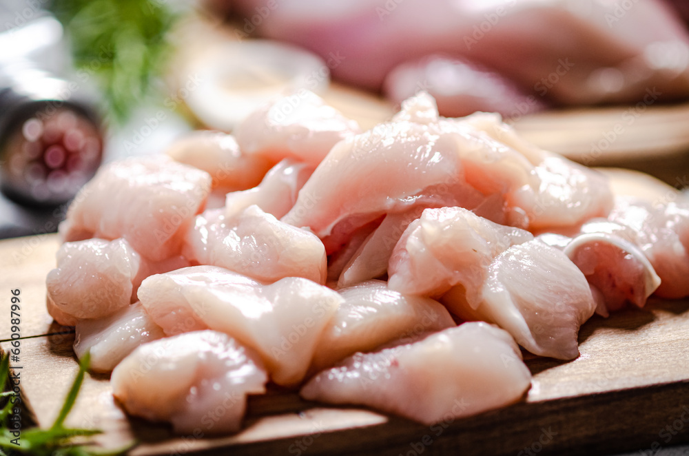 Sliced chicken fillet. On cutting board. Sliced chicken fillet. On cutting board.