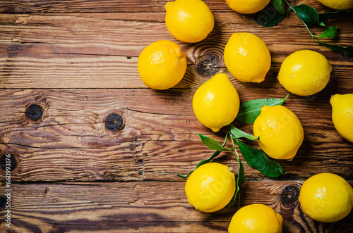 Fresh lemons. On wooden table.