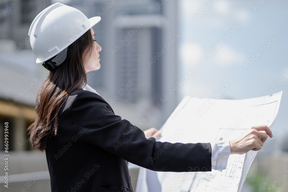Estate architect working on real estate structure engineering in urban. Female property development engineer reading blueprint, plan skyscraper layout. Beautiful woman designer plan apartment project. Estate architect working on real estate structure engineering in urban. Female property development engineer reading blueprint, plan skyscraper layout. Beautiful woman designer plan apartment project.