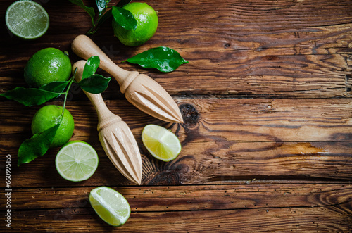 Fresh limes. On wooden table.