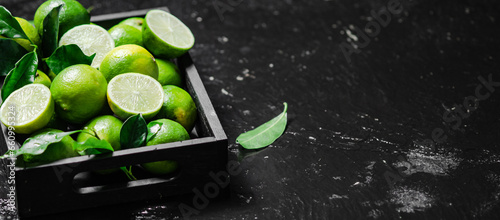 Fresh limes. On black table. © Artem Shadrin