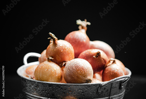 Fresh onions . On table