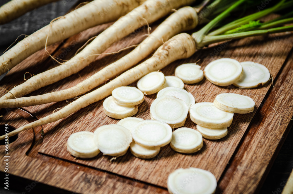 Chopped parsley root. On table Chopped parsley root. On table