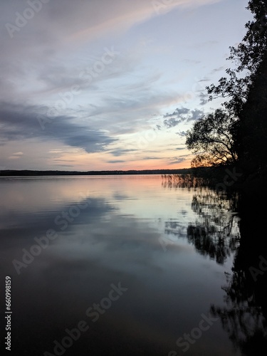 Sunset over a lake © Mateusz
