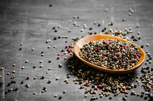 Peppercorn on rustic background.