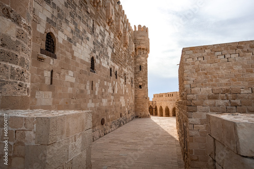 Citadel of Qaitbay building ancient fort at Mediterranean sea coast, in Alexandria, Egypt photo