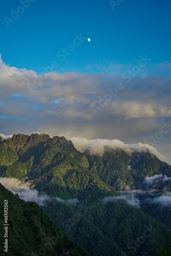 Daylight Crescent: Mountain's Silhouette