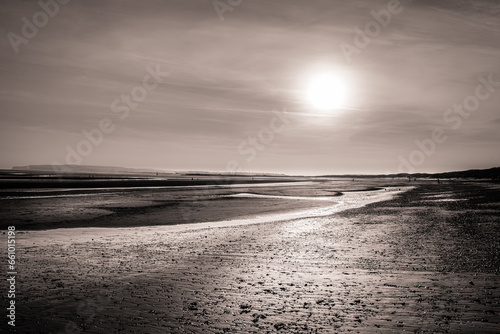 Sunset on Camber Sands beach at low tide in East Sussex, England