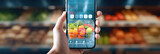 Online grocery shopping banner at fingertips: close view of hand and smartphone