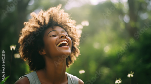 Happy young woman laughing in forrest . Sunset, freedom.