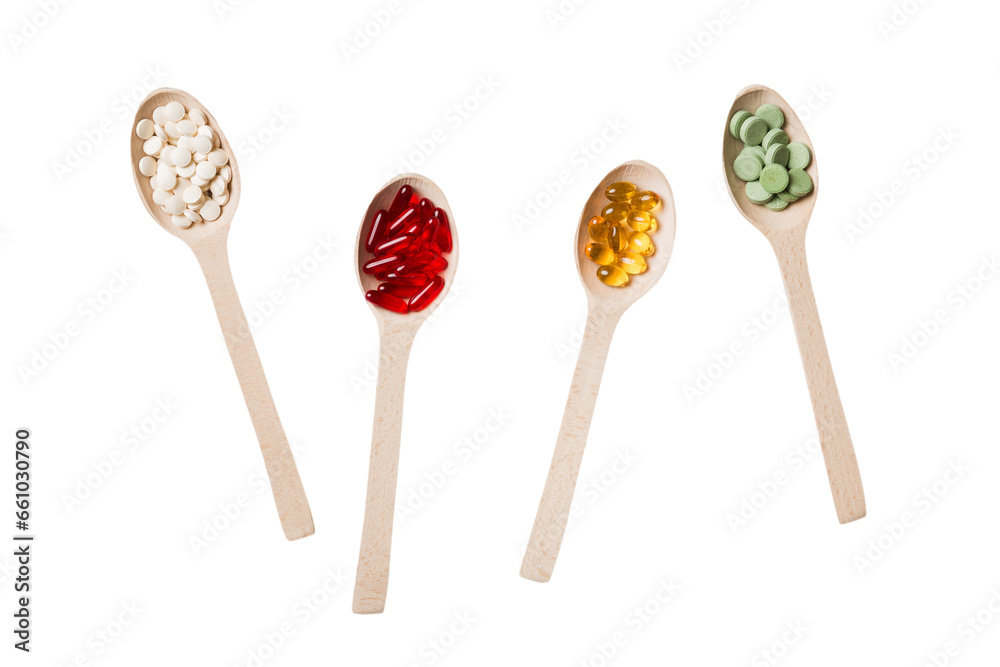 Top view Variety of vitamin and mineral pills in wooden spoon on Colored background. Top view of assorted pharmaceutical medicine pills. Dietary supplement healthcare product Top view Variety of vitamin and mineral pills in wooden spoon on Colored background. Top view of assorted pharmaceutical medicine pills. Dietary supplement healthcare product