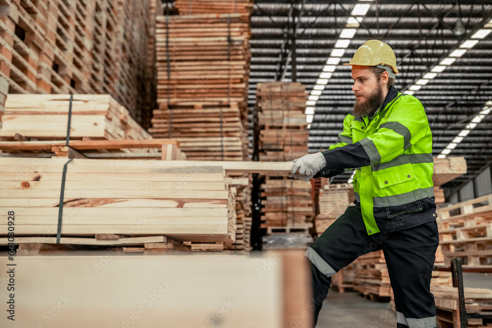 Determined woodworker measures, shapes, and balances wood with precision using hand and power tools Determined woodworker measures, shapes, and balances wood with precision using hand and power tools