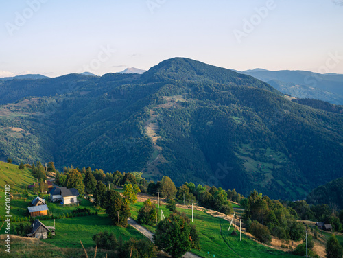 Village in Transcarpathia region scenic Carpathian mountains view Ukraine  Europe. Autumn countryside landscape fall spruce pine trees. Eco Local tourism hiking Recreational activities Vacation