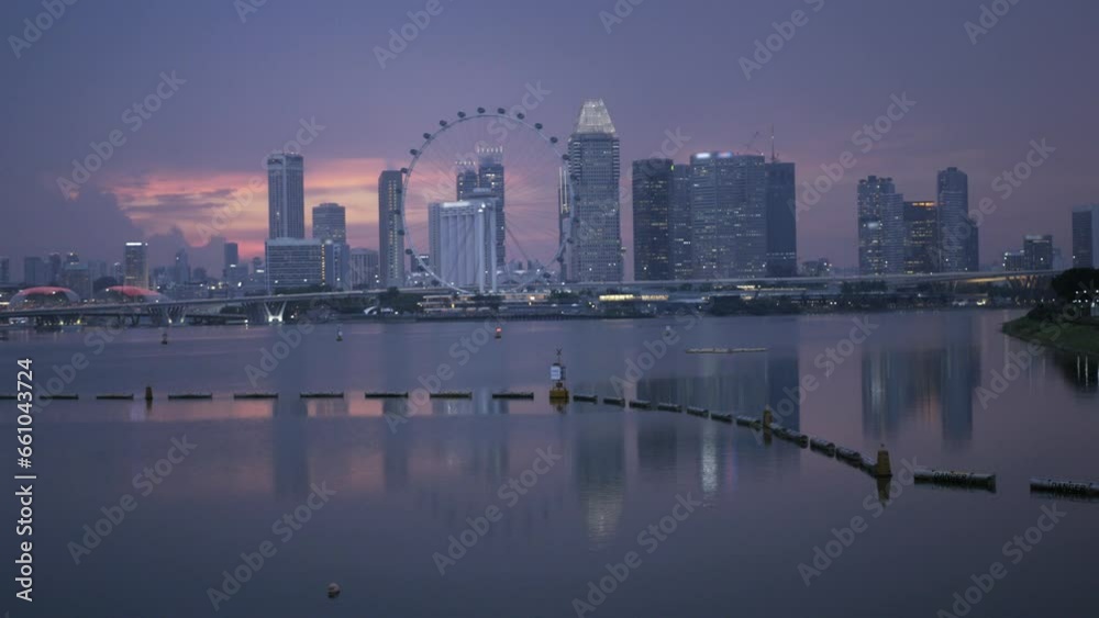 Singapore skyline city at riverfront of singapore river with modern office highrise skyscraper financial buildings in central business district in sunset beautiful time. Singapore skyline city at riverfront of singapore river with modern office highrise skyscraper financial buildings in central business district in sunset beautiful time.