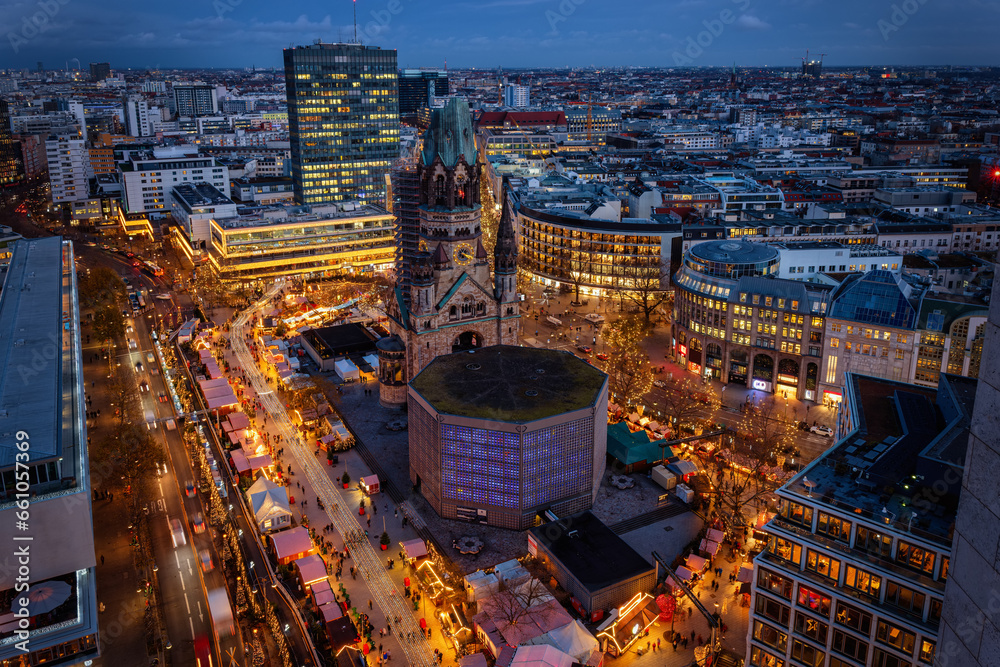 Fototapeta premium Elevated evening view of the City Center West skyline of Berlin with Memorial Church and a christmas market during the festive season