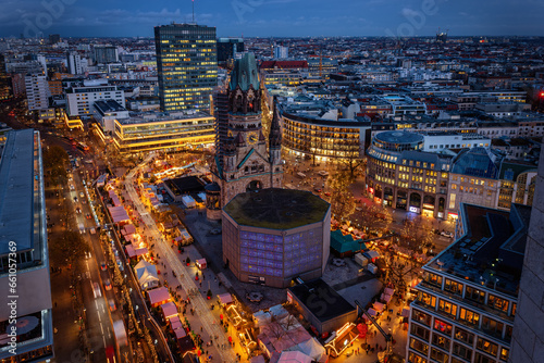 Elevated evening view of the City Center West skyline of Berlin with Memorial Church and a christmas market during the festive season photo