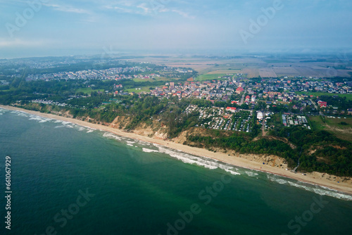 Aerial view of sea landscape with sand beach in Wladyslawowo. Baltic sea coastline in Poland. Resort town in summer season © Lazy_Bear