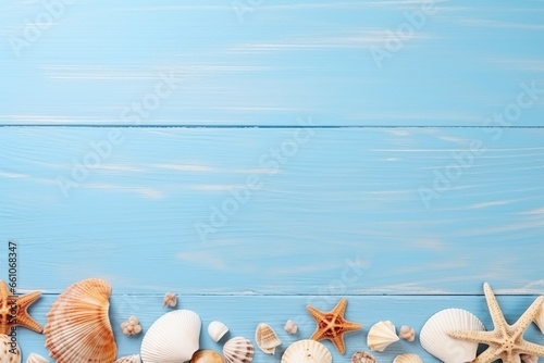 Evoking the essence of summer with a flat lay of seashells delicately arranged on a blue wooden banner background, this photo also provides ample empty space for custom use.