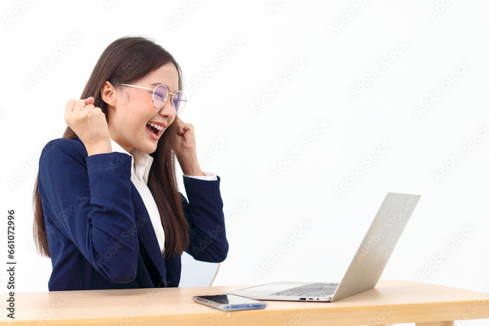 Female employee working in the office, she smiles happily looking at the laptop computer screen. Business concept. Entrepreneur. manager. White background. Female employee working in the office, she smiles happily looking at the laptop computer screen. Business concept. Entrepreneur. manager. White background.
