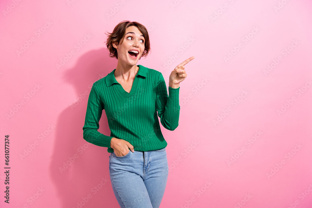 Portrait of impressed woman with short hair wear stylish clothes look directing at discount empty space isolated on pink color background Portrait of impressed woman with short hair wear stylish clothes look directing at discount empty space isolated on pink color background