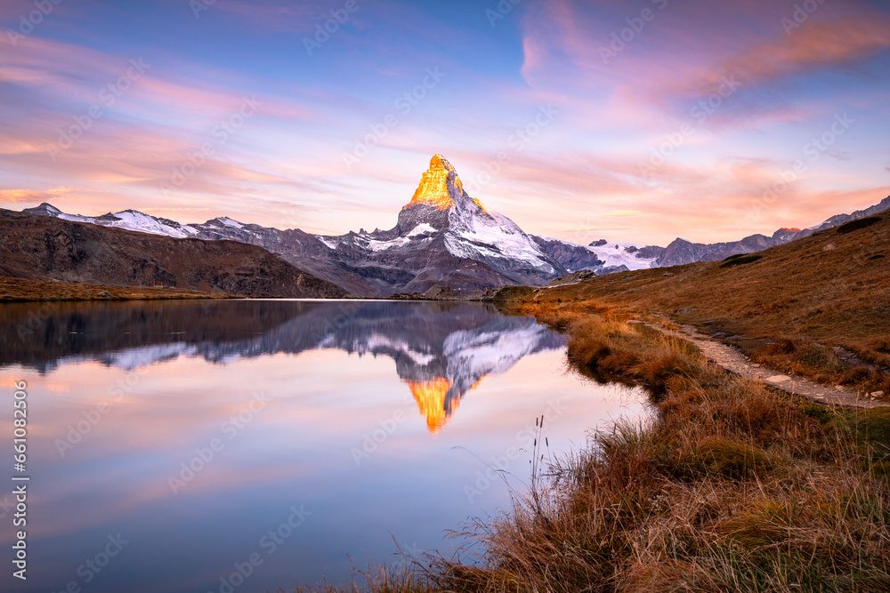The famous Matterhorn reflected in the Stellisee during dawn. Zermatt, Switzerland
