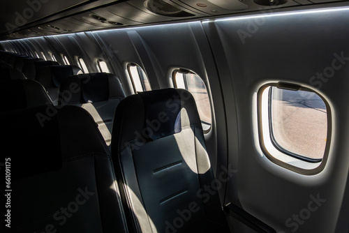 Helsinki, FInland The inside of a small passenger airplane and windows. © Alexander