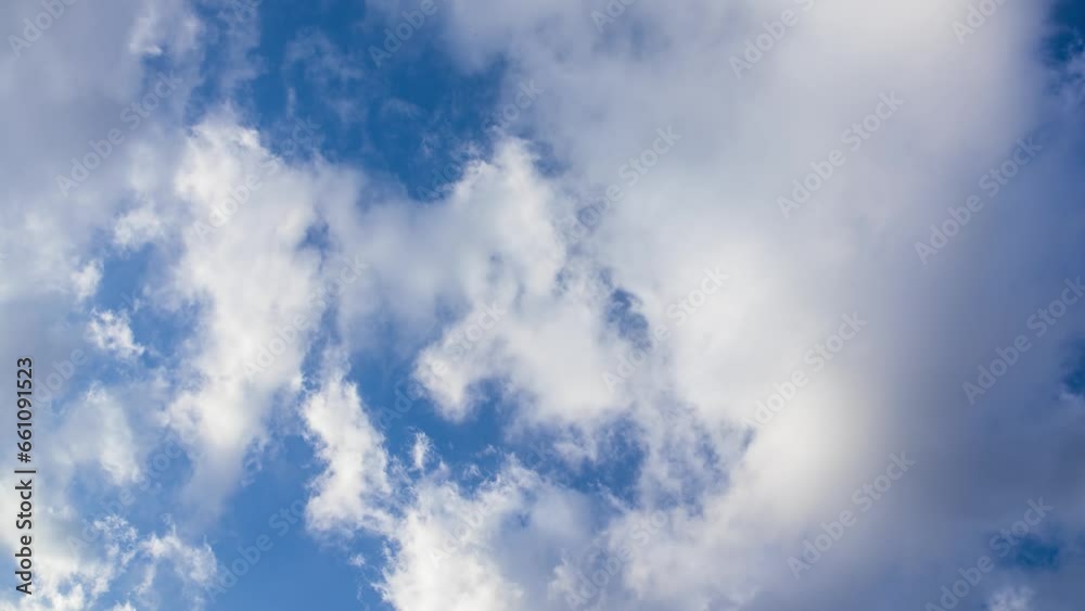 Timelapse of white clouds flowing in the afternoon blue sky Timelapse of white clouds flowing in the afternoon blue sky