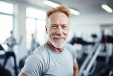senior old man happy expression in a gym. fitness teacher concept. 