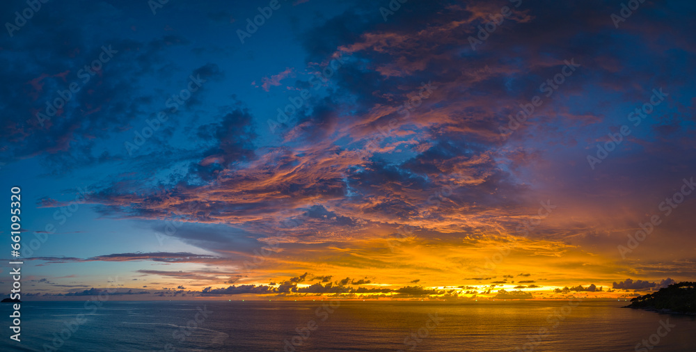 ..aerial panorama view amazing cloud with purple shadow in blue sky during beautiful sunset..Gradient color. abstract nature background..Scene of colorful orange light trough in the sky background.