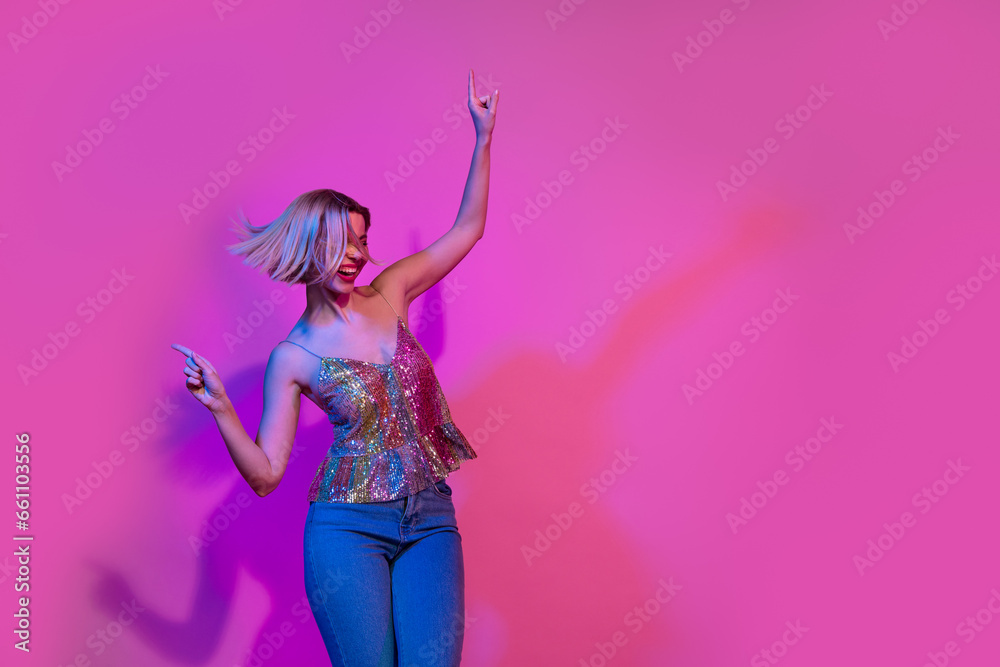 Photo of lady youngster feel funny funky dancing night club event advertising isolated neon vivid color background Photo of lady youngster feel funny funky dancing night club event advertising isolated neon vivid color background