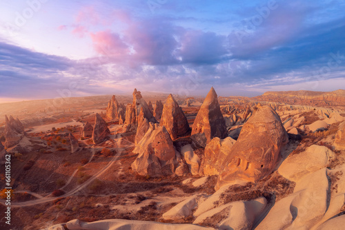 Aerial top view Sunset landscape Cappadocia stone and old cave house in Goreme national park Turkey sunlight