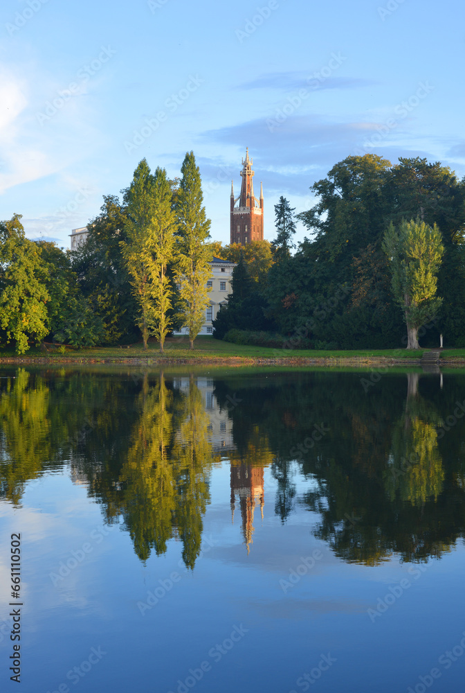 Church tower from Woerlitz Oranienbaum mirroing in a pond Church tower from Woerlitz Oranienbaum mirroing in a pond