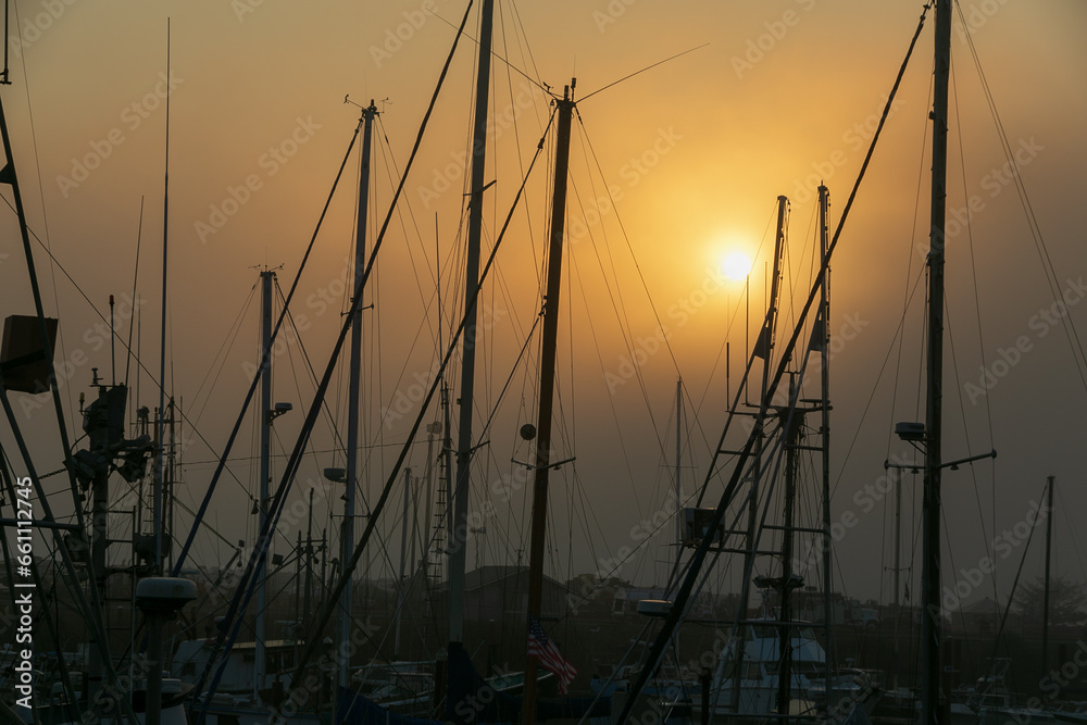 Sunset amidst the ship masts at the boatyard in Brookings, Oregon.