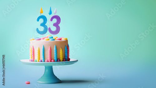 33rd year birthday cake on isolated colorful pastel background