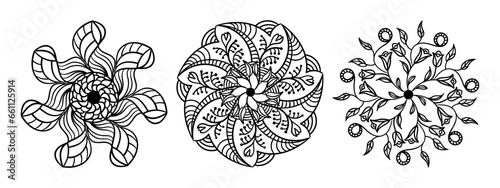 Three circular ornaments. Ethnic black and white floral patterns. Mandala. 