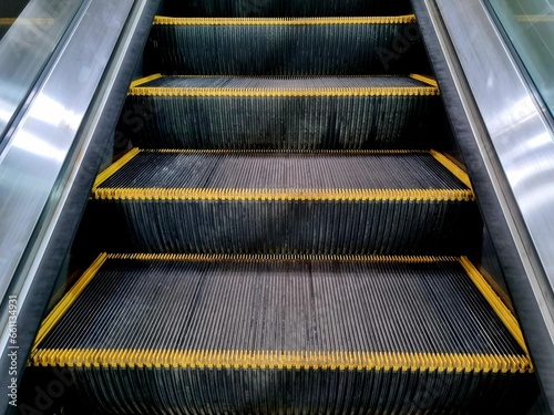 The escalator has a yellow border.