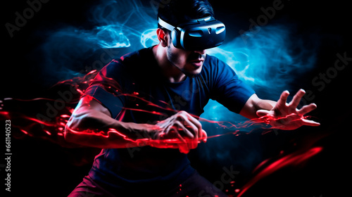 Young athletic male gamer wearing virtual reality goggles in action black background and neon lights accompany movements