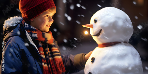 boy playing with snowman at christmas © Demencial Studies