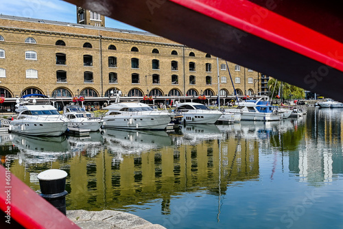 London, UK, 3 September 2023: St Katharine dock in London, UK. Modern yacht and boat pier near Tower Bridge  photo