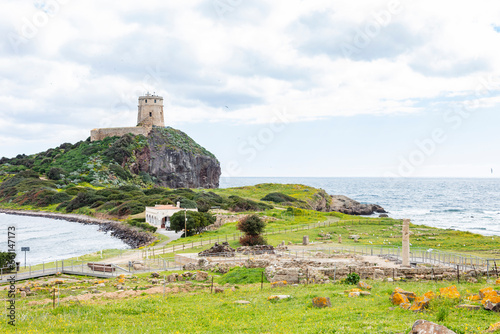 Ruins of Roman civilization  Nora  Sardinia  Italy  Lighthouse in background