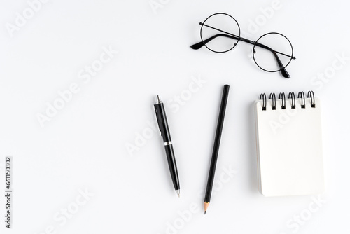Business accessories on white table with copyspace. Office desktop