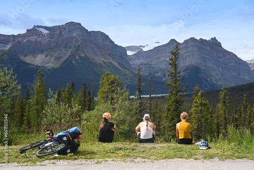 Cyclists rest in the mountains. Tourists in Banff National Park, Alberta, Canada.