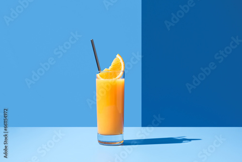 Glass of cocktail with slice of orange photo