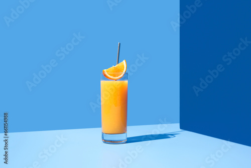 Glass of cocktail with slice of orange