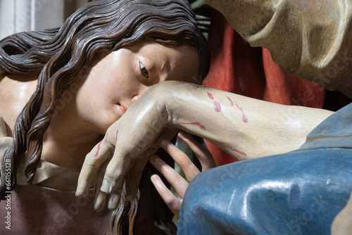 GENOVA, ITALY - MARCH 8, 2023: The detail of carved polychrome sculptural group of Pieta in the church Chiesa di san Filippo Neri by Anton Maria Maragliano (1664 - 1739). photo