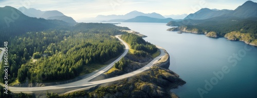 Aerial perspective of a winding section of the Sea to Sky Highway, showcasing the road's integration with the stunning coastal landscape. photo