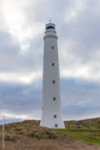 Photograph of Cape Wickham Lighthouse in a green field near Bass Strait on King Island in Tasmania in Australia © Phillip
